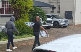 Properties connected to suspects in the murder of Emmanuel Mbense are being searched.