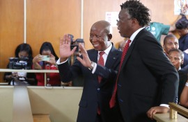 Economic Freedom Fighters (EFF) leader Julius Malema (CL) and a member of his legal team Tembeka Ngcukaitobi (CR) stand in the dock at the KuGompo City Regional court in East London on April 15, 2026 for his sentencing for firing an assault rifle at a rally eight years ago.