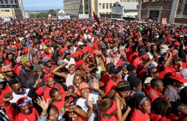 Supporters of Economic Freedom Fighters (EFF) leader Julius Malema listen to his speech outside the KuGompo City Regional court in East London on April 15, 2026 following his sentencing for firing an assault rifle at a rally eight years ago.