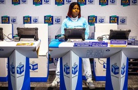 An official sits at a voter registration table at the launch event for the 2026 Municipal elections. Per-Anders Pettersson/Getty Images