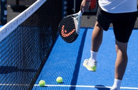 A ball and racket used to play padel tennis. AFP/Alain Jocard