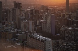 A general view of high-rise buildings of the Johannesburg skyline from the 51th floor of Ponte City, also known as Ponte Tower, in Berea, Johannesburg on May 24, 2024. (Photo by Michele Spatari / AFP)