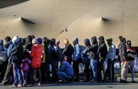 Zimbabwean nationals line up as they wait to be registered at a Department of Home Affairs Refugee Reception Centre. AFP/Rodger Bosch