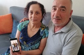 Kerban Kalin and Ali Kalin show a photograph of their son Cadet Officer Alper Kalin who has been serving a life sentence following the last coup in Turkey.
