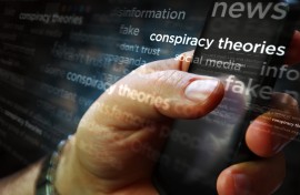 File: Social media on display with conspiracy theories, hoax theory and fake news. GettyImages/Arkadiusz Wargula
