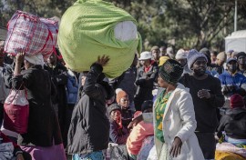 File: A group of Malawian undocumented migrants gather in front of the Malawian Consulate building to prepare for their return home. Ihsaan Haffejee/Anadolu via Getty Images