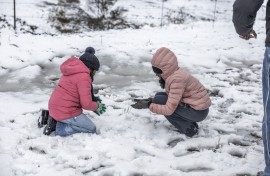 Children play with snow opposite Nottingham Road near Pietermaritzburg on 10 August. Photo by RAJESH JANTILAL / AFP