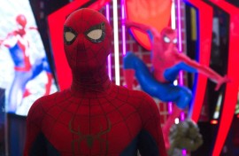 A man dressed as Spider-Man poses in front of a Marvel Studios Spider-Man booth. Ying Tang/NurPhoto via AFP
