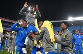 Themba Zwane of Mamelodi Sundowns FC is lifted by his teammates. Lefty Shivambu/Gallo Images