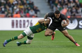 Cobus Reinach tackles New Zealand's hooker Codie Taylor 