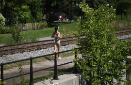 A woman jogs along a canal in Montreal, Quebec, Canada, on August 21, 2026. (Photo by Graham Hughes/NurPhoto via Getty Images)