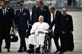 Pope Francis is welcomed by Portuguese President Marcelo Rebelo de Sousa after landing at the Figo Maduro air base in Lisbon