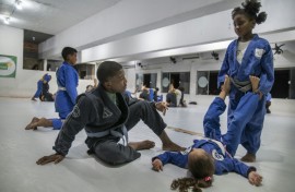 Students attend a jiujitsu class at the Cantagalo Jiu-Jitsu gym in Rio de Janeiro, Brazil