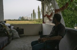 Yusuf, who watches the Afsin plant from his balcony, says pollution is harming local agriculture 