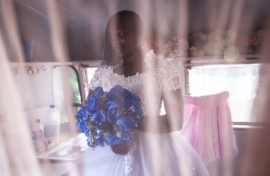 The big day: Bride-to-be Memory poses for a portrait after getting fitted for her wedding gown