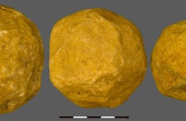 Three limestone "spheroids" from the 'Ubeidiya site in Israel, which researchers believe were deliberately made into spheres 1.4 million years ago