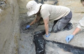 Archaeologists excavating the prehistoric wooden structure at Kalambo Falls in Zambia