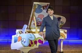 Pianist Lang Lang poses during the unveiling of the 'Steinway x Disney: Mickey Mouse Limited Edition' piano event at Steinway Hall New York in October 2023