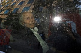 Seen through a police vehicle window, Canadian-Finnish fashion mogul Peter Nygard leaves a courthouse in Toronto. He is on trial for the alleged sexual assaults of four women and a girl between 1988 and 2005