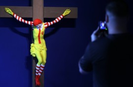 A visitor looks at 'McJesus' by Finnish artist Jani Leinonen at a new Barcelona museum dedicated to art that has been censored