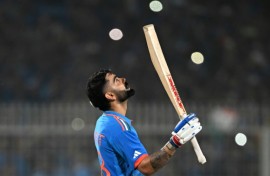 Moment of glory: Virat Kohli celebrates after scoring his 49th ODI century on Sunday 