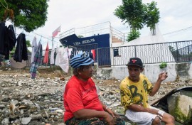 Rosie Boaquena, 63, moved to a new concrete house 13 kilometres from downtown Tacloban, but two of her sons chose to stay in a one-room shack by the sea to be closer to their jobs