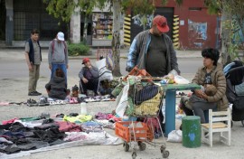 In and around the bustling Argentine capital, it is an increasingly common sight for people to knock on doors asking for second-hand clothes to wear, barter or sell