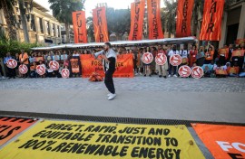 Standing ovation as nations adopt climate deal on fossil fuels