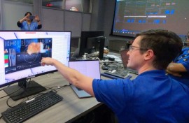 Jet Propulsion Laboratory team members react to high-definition cat video sent from a spaceship 19 million miles away