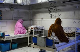 Afghan women sit beside their newborns at the Doctors Without Borders (MSF)-run maternity hospital in Khost