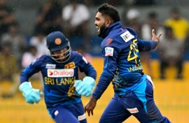 Leg-spinner Wanindu Hasaranga (R) took 7-19 as Sri Lanka skittled Zimbabwe for 96 in the third and final OCI against Zimbabwe in Colombo