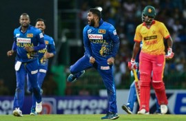 Sri Lanka's Wanindu Hasaranga (2R) celebrates taking the wicket of Zimbabwe's Richard Ngarava (R) in the third and final Twenty20 international in Colombo
