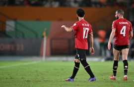 Egypt's Mohamed Salah walks off after picking up an injury against Ghana