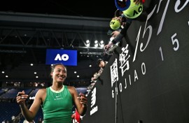 China's Zheng Qinwen signs autographs for fans after her victory against France's Oceane Dodin