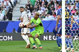 Japan's goalkeeper Zion Suzuki in action at the Asian Cup