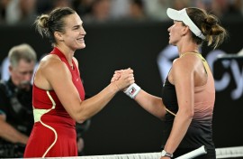 Aryna Sabalenka (L) shakes hands with Barbora Krejcikova after beating her in the Australian Open  quarter-finals