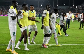 Senegal players celebrate after beating Guinea 2-0 in Yamoussoukro