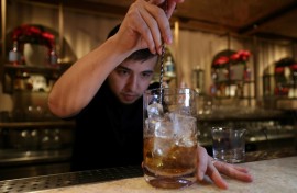 A bartender prepares a non-alcoholic cocktail in Riyadh