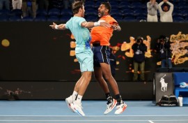 India's Rohan Bopanna (R) and Australia's Matthew Ebden celebrate after winning the Australian Open men's doubles final