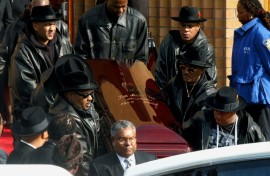 The coffin of Run-DMC's Jam Master Jay, the rapper born Jason Mizell, is carried out of a cathedral in Queens, New York, after his funeral in November 2002