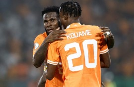 Franck Kessie (L) celebrates scoring for Ivory Coast with Christian Kouame.
