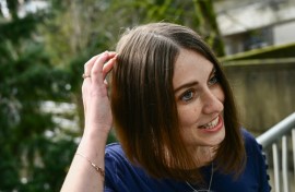 Amber Pearson, who received a brain implant to treat her epilepsy and Obsessive Compulsive disorder (OCD), shows the approximate placement of a brain implant received at the Oregon Health and Science University (OHSU) hospital in Portland, Oregon