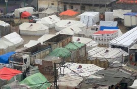 Makeshift tents flooded by heavy rain in Rafah