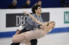 Sailing across the ice in billowing steel grey and baby pink, Gilles and Poirier wowed the crowd with their complex choreography 