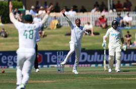 South Africa's Tshepo Moreki celebrates claiming Devon Conway's wicket during day one of the first Test against New Zealand