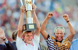 South Africa captain Neil Tovey lifts the Africa Cup of Nations trophy in 1996 as then President Nelson Mandela celebrates.  
