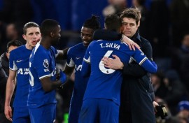 Chelsea boss Mauricio Pochettino (right) hugs defender Thiago Silva