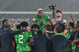 Victor Osimhen (C) and teammates celebrate after Nigeria reached the Africa Cup of Nations final.
