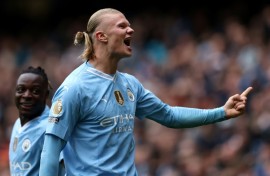 Manchester City striker Erling Haaland celebrates scoring against Everton