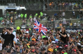 F1 fans watch the podium ceremony for the British Grand Prix at Silverstone